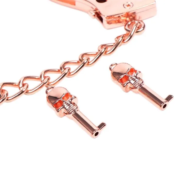 Roségoldene Handschellen mit Totenkopfschlüsseln von Latetobed BDSM Line | Fesselliebe.de